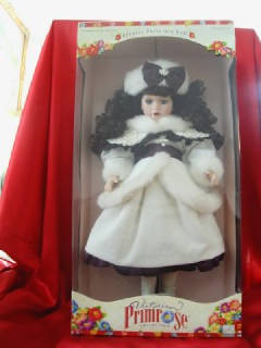 PEARL_AND_BOOT_COLLECTIBLE_PORCELAIN_DOLL..jpg